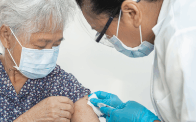 Elderly woman receiving a vaccine