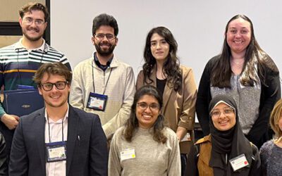 a group photo of nine smiling young scientists with their certificates
