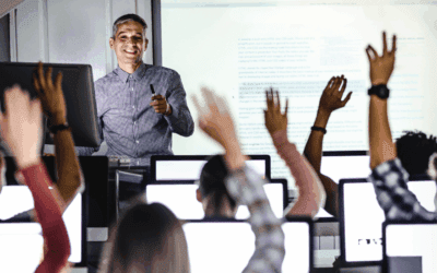 A professor teaching in a computer lab