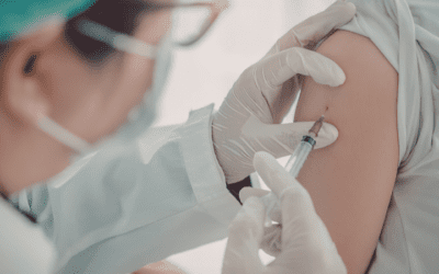 Doctor administering an mRNA vaccine to a patient