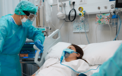 Woman in ICU after traumatic injury with nurse attending to her
