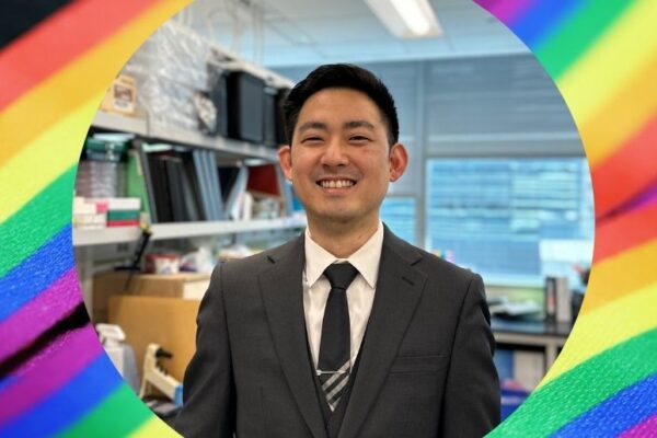 Stephen T. Yeung surrounded by a design of Pride ribbons