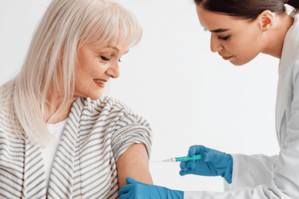 Woman receiving a vaccine