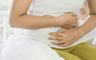 a close up of someone clutching their stomach