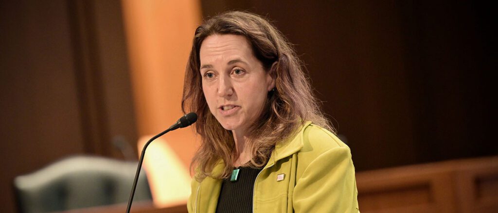 Susan Kaech speaks from the lectern.