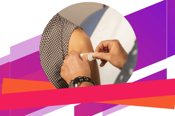 Woman getting band-aid after receiving the flu vaccine