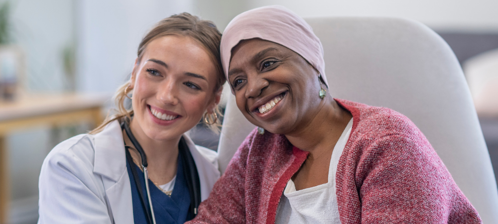 Doctor smiling with cancer patient